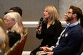 person asking a question with a microphone
