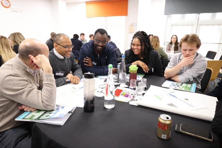 tables of people learning