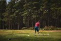 playing golf